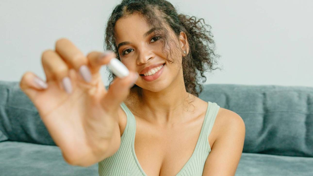Woman holding supplement